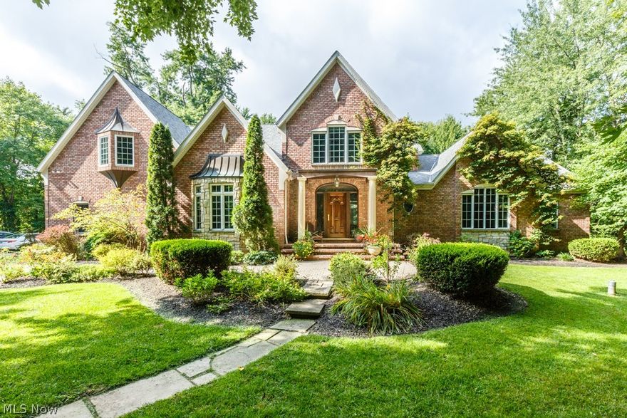 Welcome to this exquisite all brick Colonial nestled on over 2 acres that overlook a lake and is at the end of a cul-de-sac. This masterpiece has 4 bedrooms, 6 bathrooms, maple flooring in the chef kitchen and dining room. The first floor master suite has amazing views, large walk-in closets, luxurious Jacuzzi, cherry cabinets and two sided fireplace. The second level has 3 more spacious bedrooms al with built-ins. The lower level offers over 3,000 SF and a walk out to the hot tub, 2 tier deck, koi pond, fire pit and breathtaking views. This is a must see!