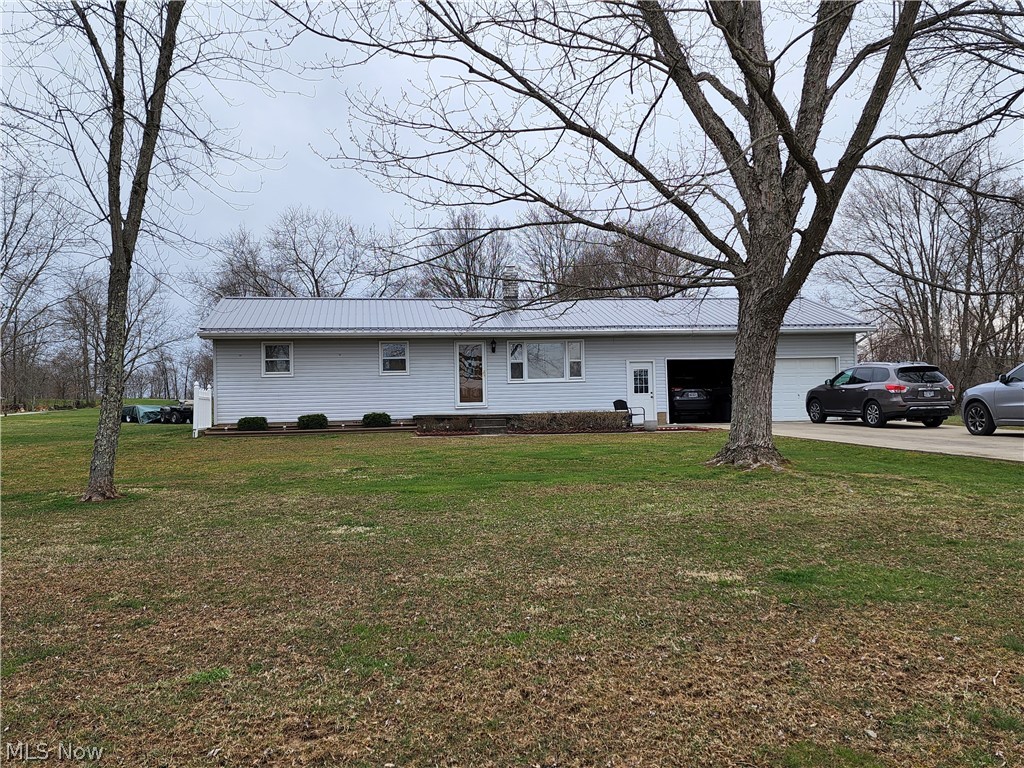 Looking for that perfect property you have dreamed of, Well here it is!! Meticulously kept 3 bedroom 1 bath home on a little over 3 beautiful acres. Updates include new tin roof and bricked chimney, all exterior doors have been replaced. Laundry room is located just right inside garage. Beautiful serene property in the country, but yet very close to town. Enjoy your days and evenings relaxing outdoors. There is a shed, nicely sized back deck, & also located past the shed on the property is a lovely deck if you just want a quick little getaway to enjoy all of your gatherings. There is also a nice outdoor swing if you want just time for peace. This property is Move in ready!! Call today for your personal showing!!