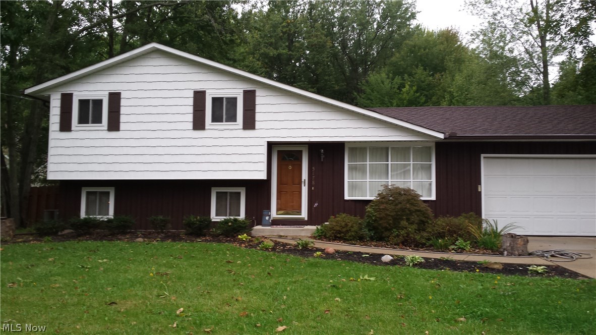 Nice 3 bedroom 1.5 bath split level situated on 1.84 acres. Full bathroom completely remodeled with all new fixtures and ceramic tile. New carpeting throughout the home. Freshly painted inside and out. Roof tear off in 2006. All appliances included. Wood burning fireplace in family room. Extra room on lower level for office/computer room or 4th bedroom without closet. 12 x 16 storage shed with electricity and loft for extra storage. Fenced in back yard. Large patio off leaded glass sliding door from dining room. Newer replacement windows and doors. Back 2/3 of property is all wooded. Two car extra deep attached garage. Newer concrete drive and sidewalks around house. Extra parking for boat, camper or RV. Ready to move in.