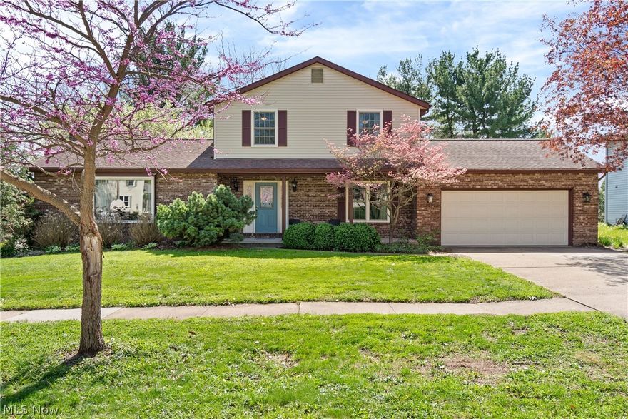 Welcome home to 1026 Douglas Drive in Wooster-a property designed for both comfort and connection. Step into the inviting foyer and immediately feel the impact of the spacious living room, featuring vaulted ceilings, a stunning floor-to-ceiling stone wood-burning fireplace, and a large window with a cozy built-in seat. The updated kitchen is the heart of the home, perfect for everyday living and entertaining alike, flowing seamlessly into the dining area and an expansive four-season sunroom filled with natural light. A convenient back drop zone, first-floor laundry, and a half bath make daily routines effortless. Upstairs, you'll find three generously sized bedrooms and two full bathrooms, including a primary suite with an impressive walk-in closet. The walk-out lower level offers even more flexibility with a full bathroom, a comfortable family room, and the potential for a fourth bedroom. Outdoor living is just as inviting, with a back deck, a patio complete with a fire pit, and a welcoming front porch-ideal spaces to relax or gather with friends. With an oversized two car garage and no small closet insight you will have all the storage needs you could ever wish for. Lovingly maintained, this home is ready to create lasting memories for years to come.