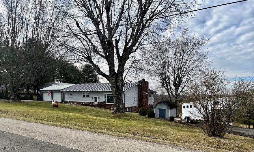Perfect location in Meigsville Township with gorgeous country views. Awaiting the lucky buyer is the house you could be lucky enough to call home.  This cozy home rests upon over 6 acres of land.  The home offers A min of 3 bedrooms, 2 baths, spacious kitchen with loads of cabinets including pull out pantry cabinets.  Off the dinning room is a covered back porch overlooking rolling land, barn/stalls and a pristine pond.  A bonus to this home is the fact they lived in the lower level while outfitting the main living area.  There’s a second kitchen, full bath, bedroom (converted to a workout area) and loads of storage space.  Perfect for an apartment, additional living or canning/summer kitchen.  The home is heated with 2 newer pellet stoves one on each level along with a gas fireplace on the main level.  The new roof is seamless metal.   Outside there’s a 2 1/2 car garage with a workshop area, pole barn for more parking/storage or work areas, outbuilding, barn with stalls and more.  Endless possibilities await… Agent will attend all showings.