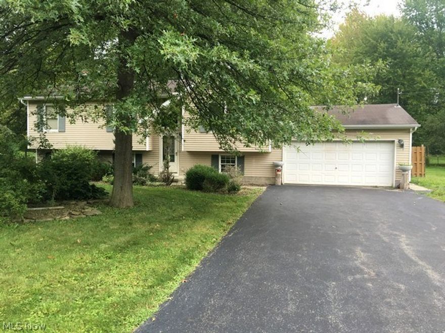 Three bedroom, bilevel located in Champion, Large living room eat in kitchen with bar, kraftmaid cabinets.  Doors leading to rear deck. Bath on first floor. Lower levels offers large family room with gas fireplace, full bath and possible fourth bedroom, and laundry room.  Previous water damage in lower level, damaged materials have been removed and needs replaced.