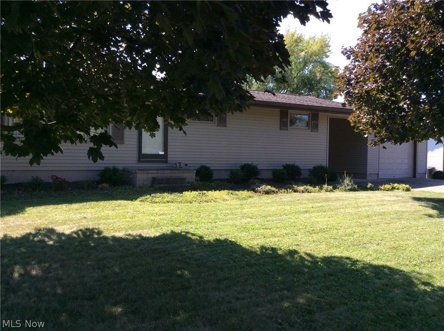 Darling one floor maintenance free ranch home, well maintained, large level lot, just outside city limits, full basement w/family room & built in bar, bright & cheery basement could have more finished living space.  Newer kitchen countertops & flooring, beautiful hardwood floors under carpets.  Large level backyard w/storage building and large open field leads to new Cross Roads Library.  Home is also close to Riesbecks grocery & Interstate 77.