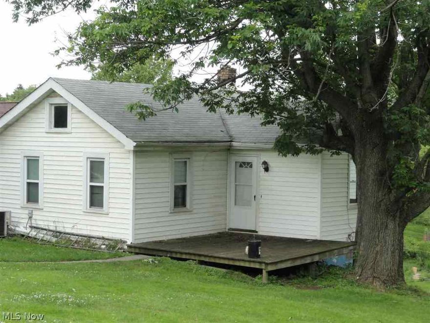 Small home with lots of charm. Very nice yard & back deck. Kitchen on lower level with laundry. Living room and bedrooms on main floor. Hardwood floors through out. Vinyl windows. Seller has had home in family for many years. Will entertain all offers.