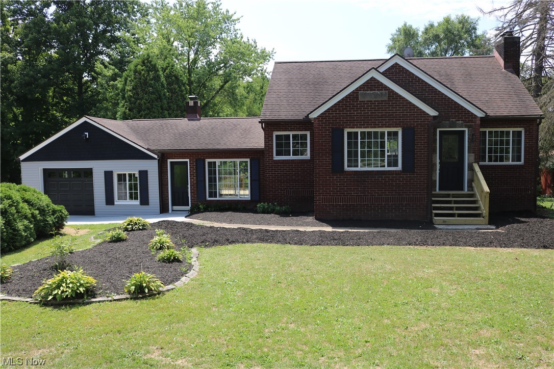 BEAUTIFULLY REMODELED brick Cape Cod home sitting on a large private lot (1.31 acres) that also has a huge, almost 1900 square ft workshop/outbuilding on that back of the lot with ENDLESS POSSIBILITIES. Just inside the front door of the house you will find a large, open living room with refinished original hardwood flooring and wood burning stove insert. From the living room, you will find a nice dining room area that over looks the front yard with mature trees. Off the dining room you will find a brand new kitchen that also includes new appliances, granite counter tops, ample storage, and large farm style sink. Next to the kitchen offers a LARGE family room with a second wood burning stove insert, and a large sliding door that leads to a new 14x10 deck that over looks the HUGE PRIVATE back yard. The back of the house offers 2 good size bedrooms, brand new full bathroom, and on the second floor there is another large bedroom. The lower level offers a large finished area with a SECOND