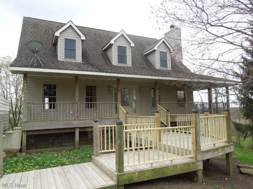 Custom Built in 2002 with an open floor plan on 3.2 acres on a dead end street. Home was built with a full wrap around porch to enjoy the full private view. The huge lot does have a creek and some woods as well as a large open space to play. Home Has a laundry room in the basement and on the second floor. The large vaulted first floor ceilings allow for a very nice office loft. The 1st Floor Master Suite with two closets, private master bathroom has a jetted tub and a shower.  Enjoy the full walk out deck onto the wrap around porch from the kitchen and dining room. Full finished walk out basement has two sections for two large areas as well as a full bathroom. The home is wired for 400 amp service too. Home is located 15 minutes from Akron, Hartville, Canton and Cuyahoga Falls. A very convenient and private location.   move in ready. No need to wait. Call for your private showing.