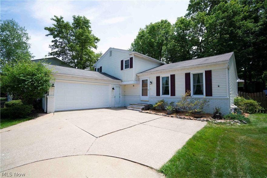 Charming 4 bedroom, 2 full bath home in the highly desirable Sturbridge Village, situated on a double cul-de-sac street and in the Medina City School District.  Enter the home through the brand new front door (4/20) and be amazed with the vaulted ceilings, open concept entertaining area, recently remodeled and updated kitchen with new cabinets, Corian counters, recessed lighting, gas stove, glass backsplash, and fresh paint.  Lower level living area, with wood burning fireplace and insert, full bath, and glass slider (2013) that opens to the welcoming 16x12 covered outdoor entertaining patio, perfect for barbeques, parties, or simply taking in the sounds of nature during a warm summer evening. Three generously sized bedrooms and full bath, remodeled in 2019, with tile shower and flooring, vanity and fixtures make up the upstairs portion of this great home.  Fourth bedroom located in lower level, great for office and located next to full bath.  Basement could be used as a workout area (