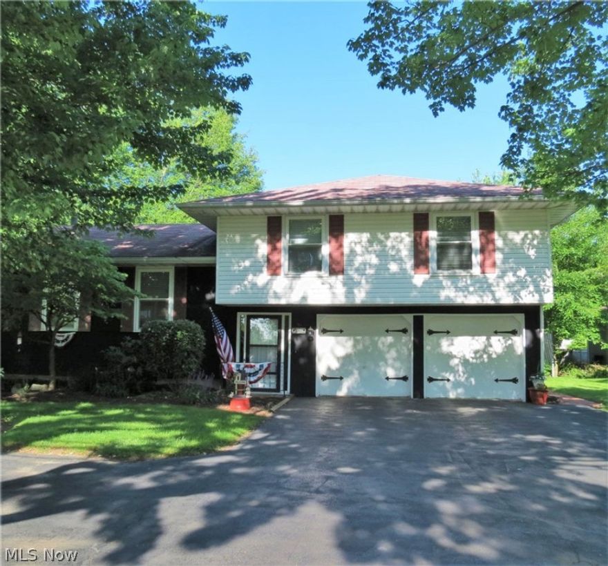 Spacious 4 bedroom, 2.5 bath split level home in the Howland School District. Charming entry welcomes you, while the large, open living room. encourages you to relax & enjoy. Beautifully updated kitchen has room for an eating area, includes all appliances. Comfortable formal dining is ready for those special occassions, includes a sliding door to the vinyl coated deck, overlooking the neatly landscaped backyard & XL patio  for your summer enjoyment. Master bedroom is complete w a master bath. 3 additional bedrooms share a second full bath. Lower level family room with a gas fireplace is perfect for a separate space which could be used for a teen suite, "Man cave', hobby room or more. 2 car attached garage provides convenience to keep you safely out of the elements from car to house. Numerous updates inside & out. Call today for your private showing and start packing!