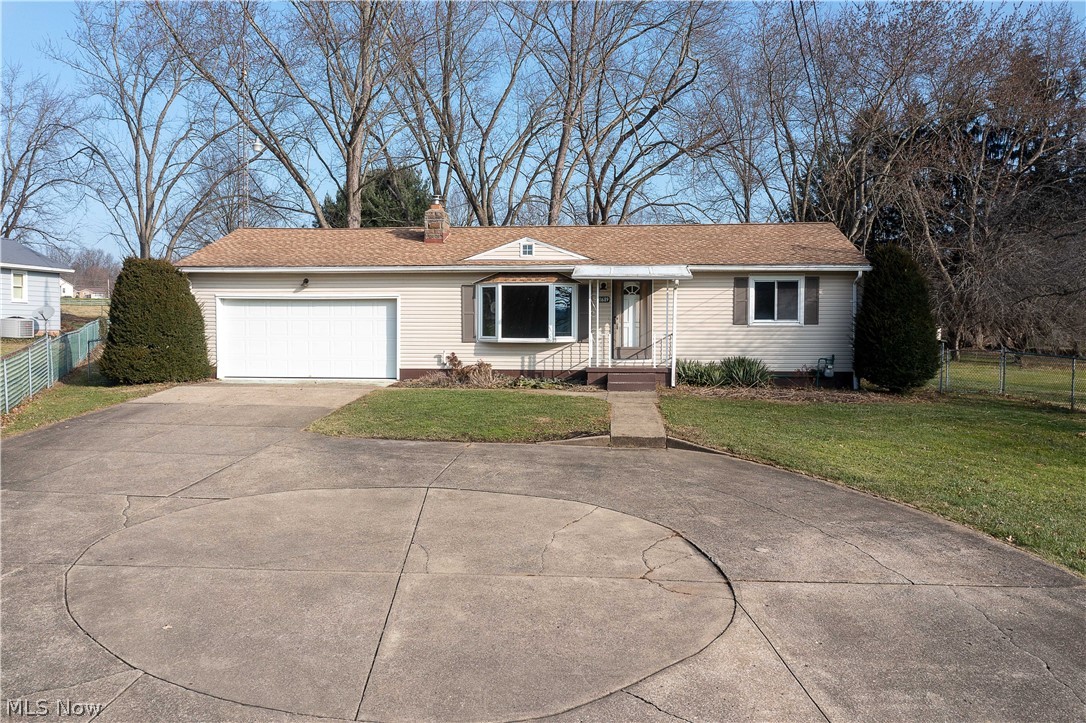 Adorable Ranch style home on 1.76 acres (two lots) located minutes to Alliance & Hartville. This lovely home offers a living room with a gas fireplace and a large bay window, an applianced eat-in kitchen, two bedrooms with hardwood floors, and a full bath. There is a sizeable three-seasons room (20x22) with walls of glass/sliding doors and a Nature Stone floor with a beautiful view of the private fenced-in backyard; a patio, shed, an attached 2-car garage with an expansive concrete driveway & turn around. The basement has a finished rec room, a shower, and an abundance of storage space. There is also a laundry hookup on the first floor. Updates include Windows replaced around 2015; New Tempstar Gas Furnace and Central Air. 10 Year Warranty (2018); Replaced One of the Sump Pumps in the Basement, Replaced Well Pressure Tank. Installed by Davidson Well Drilling, Sanded and Polyurethaned bedroom floors (2021); Ohio State Waterproofing waterproofed the basement by the previous owner, etc.