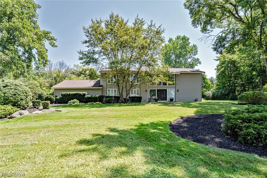 Welcome home to this elegant colonial on a highly desirable street in Pepper Pike! This striking home provides 3,480 square feet of living space with tasteful updates throughout. As you step inside, you will immediately appreciate the soaring ceilings and abundant natural light in the foyer. You will find a spacious living room to your right and the formal dining room to your left, both with gorgeous herringbone pattern hardwood floors. Straight ahead, there is a gorgeous vaulted family room with a fireplace, sliding doors to the backyard, and a stunning natural wood ceiling. You will love the kitchen, which includes an island, high-quality cabinetry, stainless steel appliances, and a sunny eat-in area. There is one bedroom / office on the first floor, along with an en-suite full bathroom. A mudroom and a convenient laundry room with appliances complete the first floor. Upstairs, you will find four spacious bedrooms and two bathrooms, including the owner's suite. The owner's suite includes a large bedroom, two walk-in closets, a luxurious en-suite bath with a soaking tub, a step in shower, and two vanities, plus, there is a custom shoe closet with organizers! The full lower level has been recently waterproofed and is just waiting to be finished into a spacious rec room or home gym. Outside, the yard is lined with trees to provide privacy, and there is an attached 3-car garage. Located just off of Fairmount, this home provides easy access to all area ammenities.