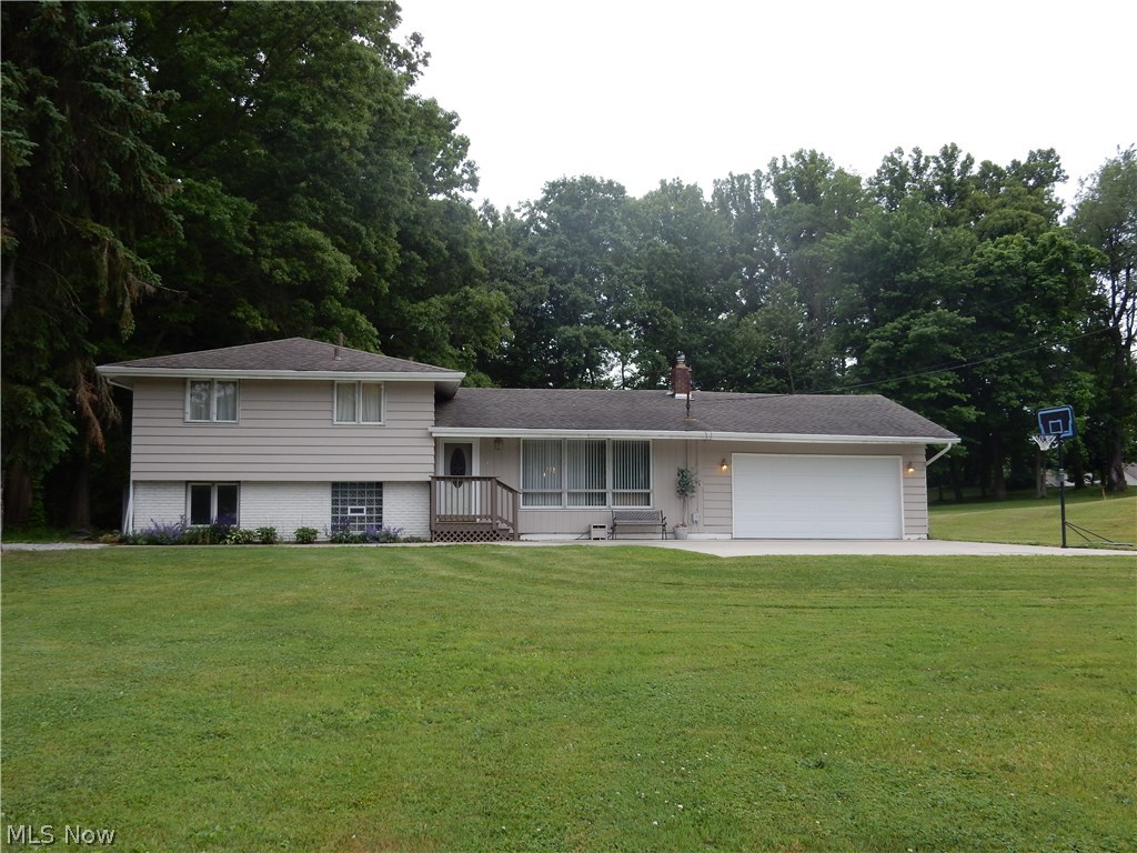 You will absolutely fall in love with this recently updated, beautiful split-level. This bright home offers an open floor plan, vaulted ceilings and huge windows to let in the sunlight. Fully applianced, updated kitchen (2014) with plenty of storage space, two updated full baths (2012 and 2014), all wood floors have been refinished (2009). All of the hard-surface flooring in this smoke-free home makes cleaning a snap. Four bedrooms, (3 upper, 1 lower) allow plenty of space for a mother-in-law or teenager. Plenty of room for kids or pets on nearly an acre of land in the award winning Green LSD. Imagine entertaining friends and family on the tiered deck, which leads to an easy to maintain above ground pool. The new cement pad (2012) out front will entertain the basketball enthusiast, bike rider or budding chalk artist for hours. Are you ready to relax after a hard day at work? Call today to schedule your private showing.