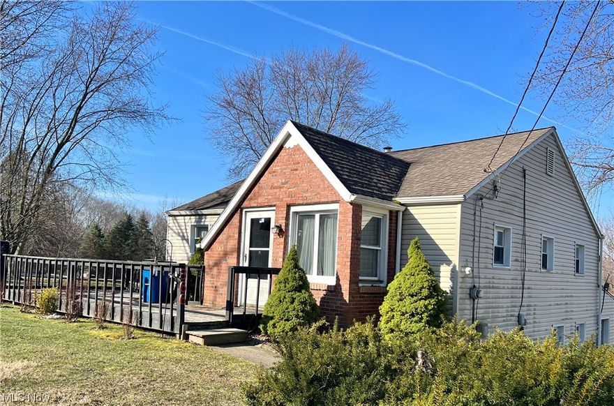 HEART OF HOWLAND walking distance to Junior High and Intermediate schools! This vinyl ranch with rear addition and ginormous garage sits on .7 acres in the heart of Howland. Replacement windows throughout.  Main home features 2 BR and updated bath & steam heat while the addition offers a large living area, 1BR and bath with gas forced air and central AC. Separate entrances. Main house also features 25x13 attic. Ginormous 25x35 garage is perfect for car buffs or a shop. Good bones needs a little TLC but the Howland location and the amount of property and garage is PRIMO. Selling AS IS.