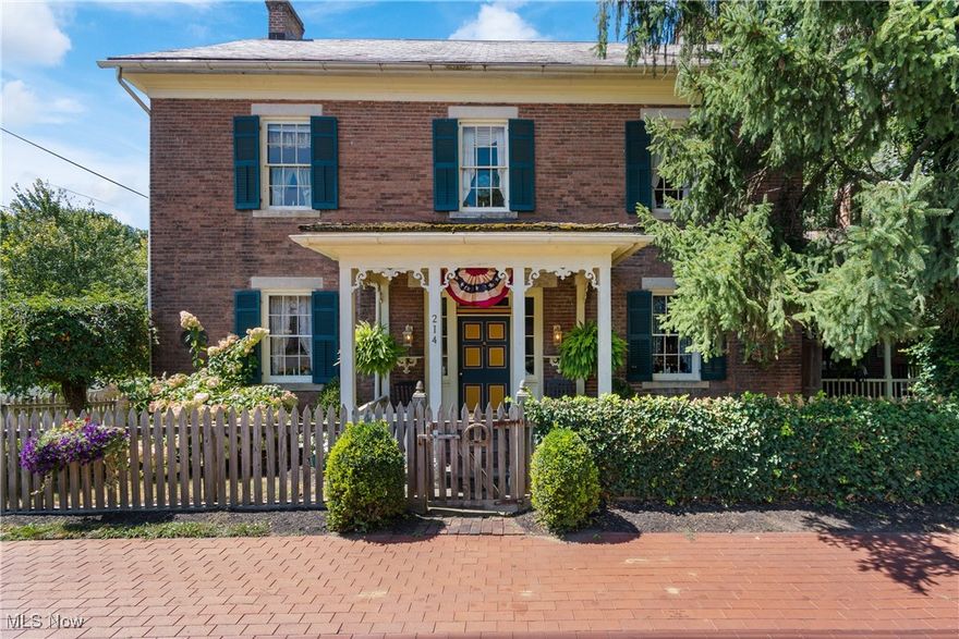 Step into a piece of history with this charming 1877 Zoar home, once the residence of Louis Zimmerman, Treasurer of the Zoar Society. Nestled in the heart of the Historic District of Zoar Village, this remarkable property is listed on the National Historic Register and recognized by the Tuscarawas Heritage Home Association. Spanning 2,528 square feet, this lovingly preserved home offers 7 rooms, 3 bedrooms, 1.5 baths, a welcoming foyer, and the convenience of a second-floor laundry, all situated on a picturesque corner lot.
As you explore, you'll be captivated by the original white oak tongue-and-groove flooring, secured with square nails. The home comes with a stunning 16x20 fully furnished wine cellar, perfect for enthusiasts and entertainers alike. Many Zoar artifacts and furniture pieces will be left with adding to the home's timeless charm.
Outside, a weathered Zoar-style wooden fence encloses the beautifully landscaped yard, creating a private oasis. Enjoy gatherings on the brick patio, relax on one of two front porches, or entertain on the rear porch. The historic 18x32 Wash House, a true gem, features three distinct rooms: the original laundry room with cast iron wash tubs set in a brick fireplace, his & her privies, and a workshop with an authentic workbench.
Adding modern convenience to historic charm, a heated Carriage House was thoughtfully constructed in 2005, designed to blend seamlessly with the original outbuildings. It offers three spacious car bays, a workshop area, second-floor storage, and even incorporates original Zoar windows from another village home.
This is more than a home! It's a chance to own a piece of Zoar's rich history. Schedule a tour today and take the first step toward calling this extraordinary property your own!
