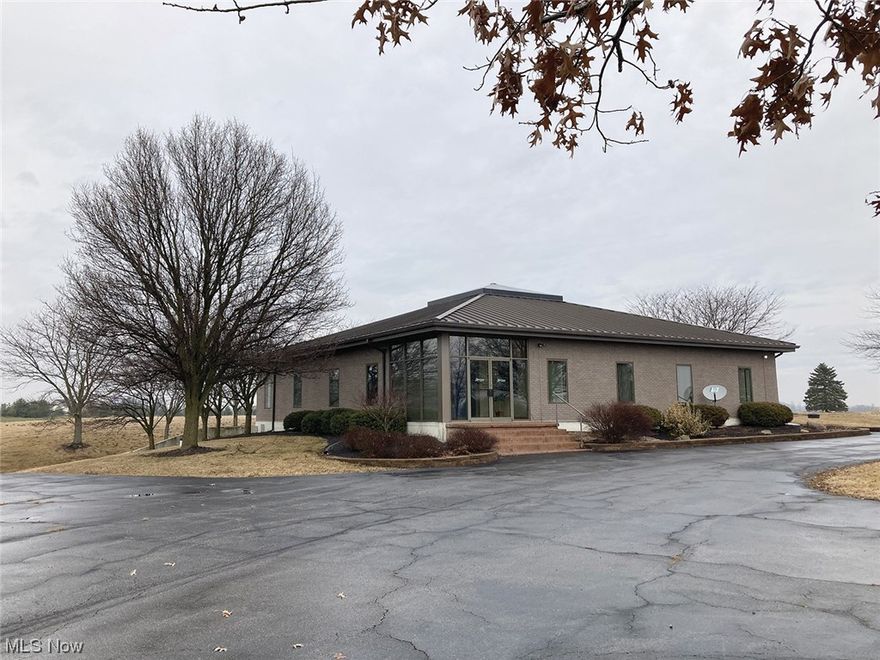 Opportunity Presents! 19+ Acres With Quality Brick Office Building - Small Lake & Commercial Septic - Vacant Land Parcels - Black-Top Parking Lot - Zoned U1, Rural - Offered In Parcels & As Unit - Loads Of Possibilities - Live & Online Bidding. ABSOLUTE AUCTION, all sells to the highest bidder on location. ONLINE BIDDING BEGINS TUESDAY, MARCH 28, 2023 - 10:00 AM and AUCTION LIVE ON-SITE BIDDING WILL BEGIN THURSDAY - MARCH 30, 2023 - 12:30 PM. REAL ESTATE: EXCITING OPPORTUNITY! 19+ Acres with a 7,900 sq. ft. turnkey brick office building ready for a multitude of uses. Includes a large, paved parking area with over 46 spaces. Overlooks gently rolling farmland. Many improvements. Great location. Loads of frontage. Real Estate to be offered as follows:
PARCEL #1: 8 acres with 7,900 sq. ft. brick office building with standing seam metal roof. Approx. 958’ road frontage. Loads of potential. Could be used for business, private residence, or both, you decide. Logan County Parcel #32-084-00-00