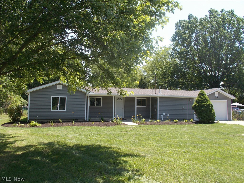 First floor living at its best in this totally updated 3 bedroom 1 1/2 bath rambling ranch on a spacious fenced lot! This beautiful home has a new roof, siding, windows, doors, furnace, a/c, kitchen cabinets and counter tops, bathrooms, flooring and lighting. Includes stove, refrigerator, microwave and dishwasher. Newer electric panel and hot water tank also. Fabulous bonus living space in the extraordinary breezeway. Nothing to do but move in!
