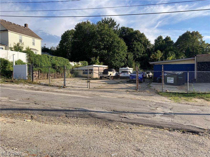 Unique opportunity to own 2 Industrial addresses (24 W Archwood and 1475 Firestone Parkway) and 4 parcels (6839362, 6821318, 6758071, 6839363) totaling 0.71 acres of land.   1475 Firestone is currently leased to auto body shop and 24 Archwood was formerly leased by a construction company.  Both fenced in with tons of storage, Pole building (Archwood), out building, directly off Main St.  Unlimited earning possibilities for the seasoned real estate entrepreneur.