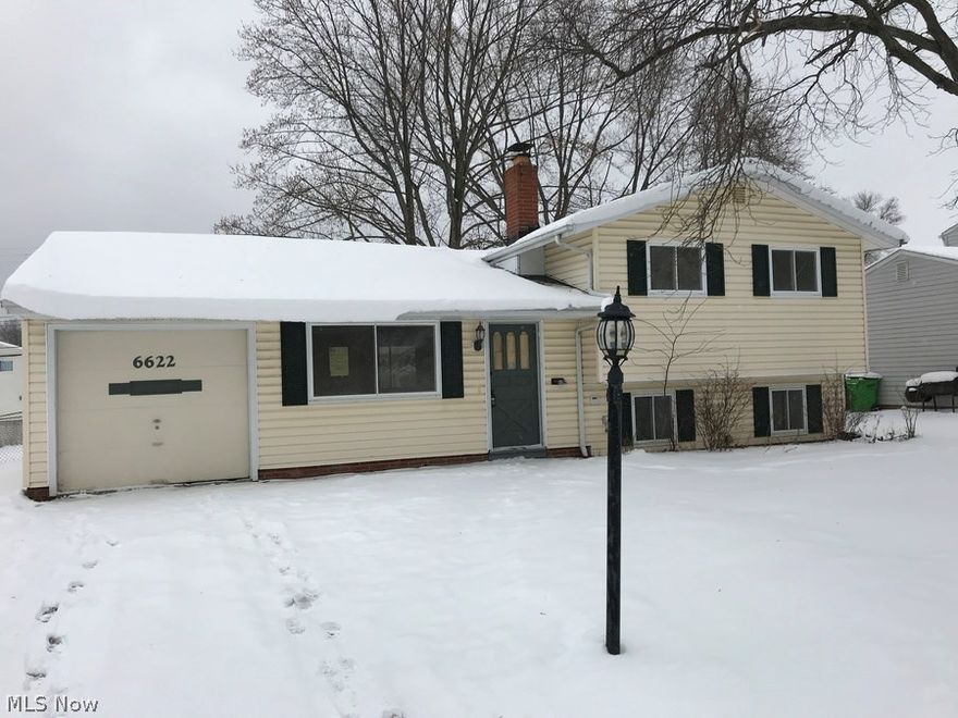 This AWESOME updated split level home features 3 bedrooms, 1.5 Bath, and an attached garage! Beautiful wood look tile throughout the main floor and modern paint colors. The spacious eat-in kitchen overlooks the big backyard. Upstairs you'll find 3 bedrooms with beautiful hardwood floors and an updated bathroom. The lower level has a great family room and half bath. Schedule your showing before it's too late!