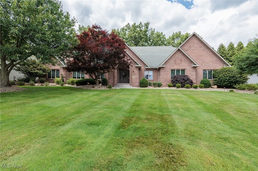 An amazing all brick custom built ranch in the prestigious Regency Park in Tallmadge.  This 4 bedroom, 4 1/2 bath beauty features over 5300 sq ft of total living space... oh and an attached 1560 sq ft garage that can easily hold 9 cars or more.  The main level features a huge great room with cathedral ceiling, a fireplace, built ins, and opens to the kitchen.  The eat-in kitchen has wonderful granite counter tops, and opens to an 18x14 dining room where you can use any size table.  A large master suite has multiple walk in closets, double sinks, and a walk in shower.  Two of the other bedrooms are ample sized, and have their own full baths.  The 4th bedroom doubles as an office/library.  Enter through a wonderful covered front porch into a grand foyer that has an updated powder room and vinyl floors.  The main floor laundry is 18x11, with built in counters and a closet.  The finished basement features multiple rooms, including an amazing family room with a bar and fireplace.  In the basement is another full bathroom, and a 35x25 rec room, as well as an additional play area/hang out room.  There is also approximately 1000 sq ft of storage space.  The HVAC was new in 2024.  The monster garage is heated, with hot and cold water, and a drain.  The back yard is private, and has a lovely rear patio.  There is a generator, stamped drive and walk way, workshop, and so much more.