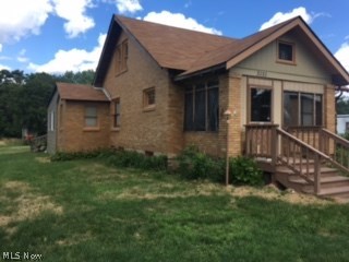2 Bedroom, brick, bungalow with an extra lot and a trailer in Indian Local School District.