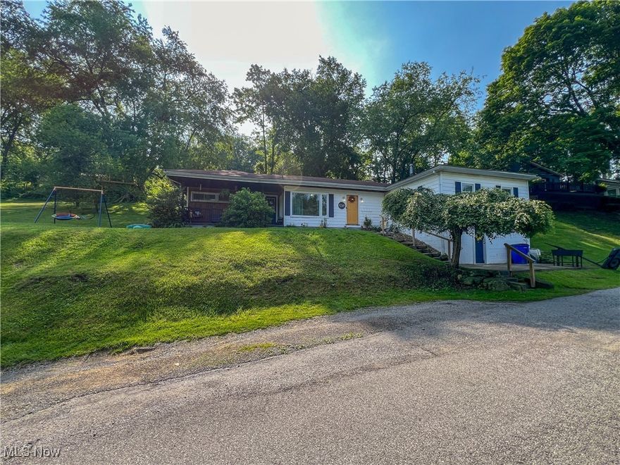 Updated three-bedroom home with first-floor laundry and two basements. This home offers an open floor plan and a large master bedroom. Downstairs, the home has a finished basement with a built-in stone bar. The front of the home features a large covered porch, while the back of the house boasts a patio. The second basement is entered from the outside and functions as a utility and storage room. The basement has been waterproofed with an interior french drain and sump pump. Updated 200-amp electrical service, updated plumbing, and a high-efficiency gas furnace.