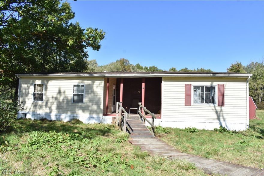 Great opportunity to own 3+ acres in a private location with a mobile home. Home is being sold as-is. Located in Williamsfield Township on a paved road, this property is about half open and half wooded. The mobile home is in need of renovating and mold remediation. It's 2 bedrooms, 1 bathroom, with a kitchen, living, dining area and office. Being sold as-is. Estate sale.