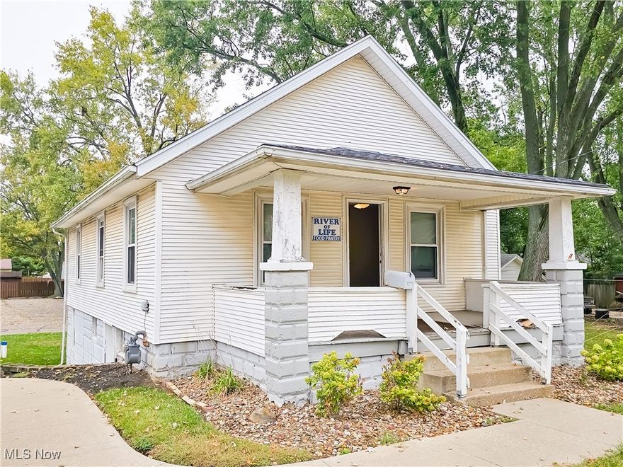 Great opportunity in the heart of Greentown! Having vinyl sided exterior, front porch, carpeted living room and dining room, bathroom with tub/shower, 2 bedrooms, kitchen, replacement windows, basement with forced air gas furnace and gas water heater, glass block windows, updated 100 amp electric, blacktop parking lot and security light. This property is located adjacent to 3281 State St, and was most recently utilized as a food pantry for the ministry but great potential as a residential home or investment property. Presently on well with city water available at the street. Home sells to the highest bidder at Absolute Auction! Property open for inspection one hour prior to auction. Located between 3281 and 3261 State St. ** This property will be sold as Auction #2 on 11/6/2024 at 4:30pm. ** Live Auction with Online bidding available.