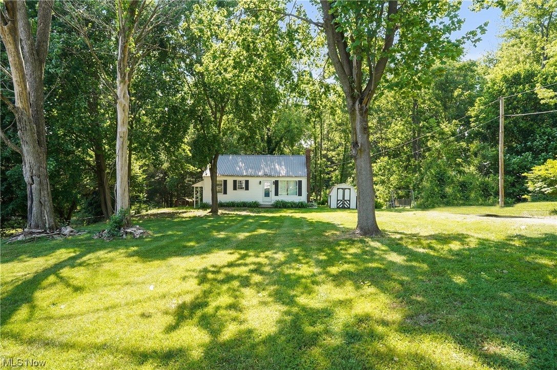 Welcome to 1532 Morris Road located in the heart of Kent! This ranch-style home features 3 beds/1 full bath & a 1 car attached garage situated on .94 acres! The house sits far back from the road on a secluded lot with plenty of frontage. Updates galore throughout. This incredible kitchen has updated quartz countertops, custom white shaker cabinets, hardware & stainless appliances -- in which stay! Newer flooring + fresh paint throughout. Metal roof. Updated baseboards + fixtures. Fully updated bathroom including tub, flooring & vanity. All new windows are included & ready for install, yet the current ones are still functional. 2 bedrooms are located on the main floor & the 3rd is located in the lower level with a walk-in closet! Laundry hookups + W&D stay! Full walkout basement with garage access. Plenty of extra storage with two storage sheds. Invisible dog fence! Immediate possession upon closing. Kent Schools. City & country living by being surrounded by all amenities such as restau