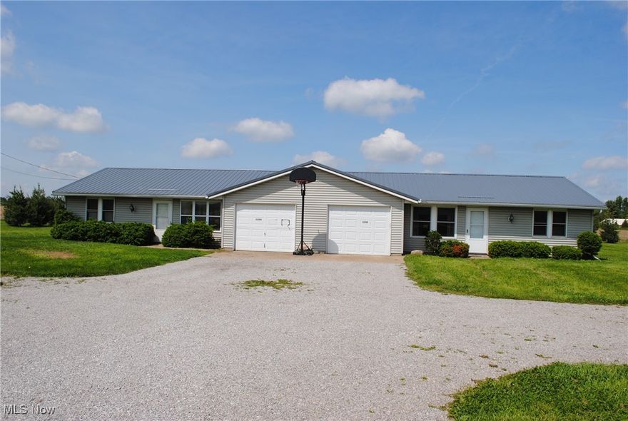 Wonderful Ranch style duplex offers convenient one floor living in a beautiful country setting.  Spacious living rooms lead back to eat-in kitchens.  In suite laundry.  2 bedrooms and 1 full bath units.  Vinyl siding.  Metal roof.  Patios.  1 car attached garages and additional parking outside.  Beautiful 1 acre lot.  Great opportunity... call agent today.