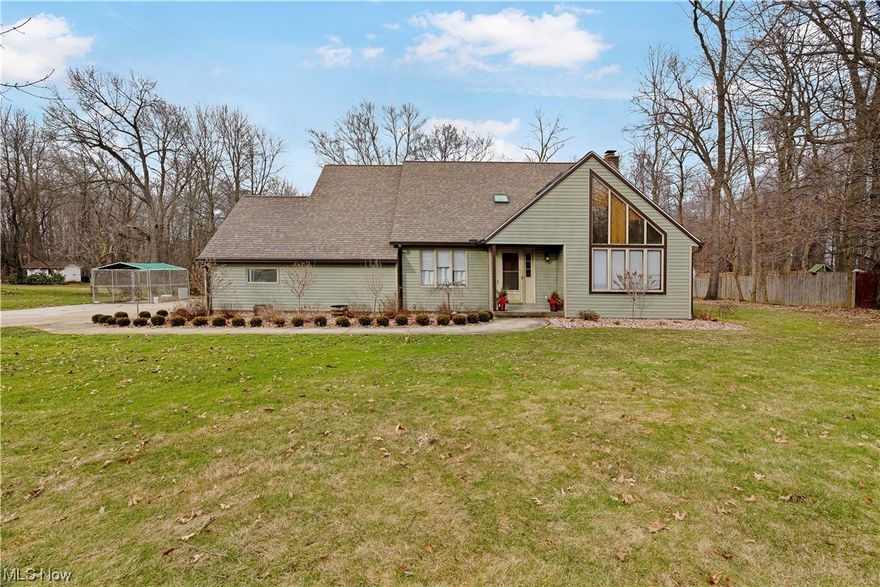 This stunning home features three spacious bedrooms and 2.5 bathrooms, offering plenty of room! Outside, you'll notice the newer siding and gutters, giving the home a fresh and modern look. The updated landscaping adds to the home's appeal, providing a welcoming atmosphere. An enclosed back porch is perfect for enjoying your morning coffee or watching the kids play in the spacious, private backyard with a wooded treeline. The living room greets you as you enter the home. You'll also find the dining room next door. The first-floor laundry, newer AC, and furnace add to the home's convenience and comfort. The large family room, complete with a cozy fireplace, is perfect for family gatherings or entertaining. The remodeled half bath comes with a single vanity. The home's newer carpet and laminate flooring give it a fresh and modern feel. The kitchen features laminate counters, bar seating, and a pantry! The bedrooms in this home are cozy, providing comfortable living spaces. The master bed