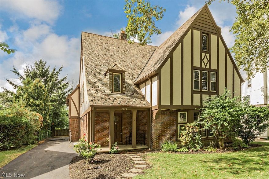 Handsome, large brick colonial nestled in the heart of the Onaway neighborhood of Shaker Heights. This home boasts 5 bedrooms and 4 full and one half bath. Outstanding architectural details include moldings, leaded windows, hardwood floors, rounded doorways. First floor has step down inviting living room with feature fireplace and leaded windows, formal dining room. The spacious eat-in kitchen has custom cabinetry, granite counters and upscale appliances and is attached to a great room with access to the deck! Second floor has four bedrooms and 3 full baths, including a private master suite with large closet and private bath with double sinks, one bedroom with en-suite and two bedrooms with a jack and jill bath. Second floor laundry! Third floor suite with bonus room, bedroom and full bath. Lower level rec room. This home has many updates including newly added central air! Attached garage and newly installed driveway. 20 new windows on the way! Outstanding location, close to schools, s