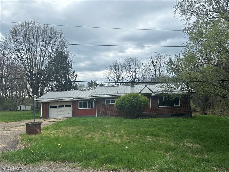 2 Bedroom Brick Ranch with attached Garage. Updates include newer windows and a newer metal roof. Large flat yard on a dead end street.  Bank owned. Selling AS IS.