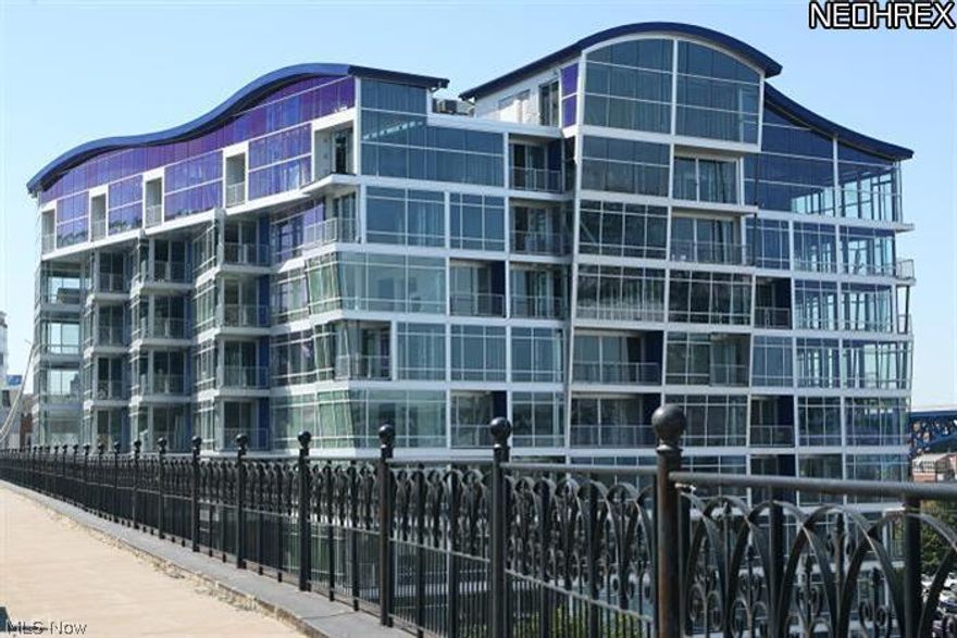 Beautiful corner unit at Stonebridge Plaza.  Great Cuyahoga River views from every floor to ceiling window.  New hardwood floors in great room, granite kitchen, granite tile showers, 2nd bedroom/office with hardwood floor and balcony, stainless appliances, downtown view from master bedroom, lots of closet space, garage parking, tax abatement, workout facility, access to Superior Viaduct.  Great location close to downtown, Ohio City, Gordon Square, Tremont and University Circle.  Easy access to all freeways.