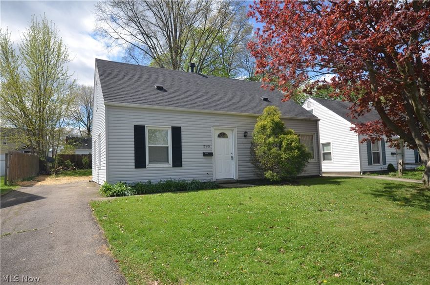 Completely remodeled Cuyahoga Falls cape in a prime location to easily get to the new Schools as well as nearby shopping and restaurants! It looks, feels and smells like a brand new home when you walk inside! Brand new flooring and paint throughout the home starts in the living room with built in shelving, decorative spindles on the staircase and access to the completely remodeled kitchen with new LVP flooring, cabinets, countertop, subway tile backsplash, GE Range and LG Refrigerator. It is such a spacious kitchen and even has a nice pantry closet for storage- plus a nice eating area w sliding glass door to the back yard and access to the 1st floor laundry/mud room. The convenience of the mud room and large dining area is made possible by an addition to this home that most of the capes don’t have. Brand new flooring and paint continues in the first floor bedrooms and the spacious full bath including a gorgeous 2 sink vanity, new shower/tub w decorative surround and all new flooring, fixtures, commode and more. The large 2 sink vanity is another hard to find feature! Upstairs are 2 more bedrooms with good head room and all new flooring and paint- one featuring a cedar closet and the other featuring built in shelving plus hallway built in drawers. There are numerous closets throughout the home for storage space. Updates include: ‘26 Kitchen, Bathroom, Carpet, LVP flooring, 6 Panel Interior Doors, A/C, Hot Water Tank, Range, Refrigerator. ‘21 Furnace. ‘20 Dimensional Shingle Roof. Even the double hung windows are updated- nothing to do here but move in and relax!