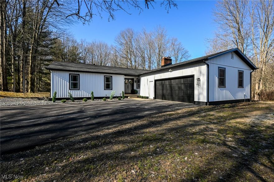 Welcome to your dream home! Located in Rootstown Township and Rootstown School District, this beautifully updated 4-bedroom, 2-bathroom residence offers a perfect blend of modern convenience and cozy charm. As you enter inside, you are welcomed into a bright and inviting living area, where the stunning brick fireplace creates a warm and welcoming atmosphere—ideal for relaxing with family and friends. Moving beyond the living space, you’ll find the spacious open kitchen, designed for both functionality and style. It seamlessly connects to the dining area, making it perfect for entertaining and everyday living. The primary suite features an ensuite bathroom and a generous walk-in closet, providing ample storage and privacy. Each additional bedroom is well-appointed, ideal for family members, guests, or even a home office. One of the standout features of this property is the picturesque outdoor space. Enjoy serene moments beside the beautiful pond and soothing fountain, creating a tranquil oasis right in your backyard. The walkout basement adds valuable additional living space and opens up to the expansive 3 acres of stunning land, offering plenty of room for outdoor activities, gardening, or further personal touches. This home truly has it all, combining comfort, style, and the versatility of a peaceful country setting. Don’t miss your chance to make it yours!