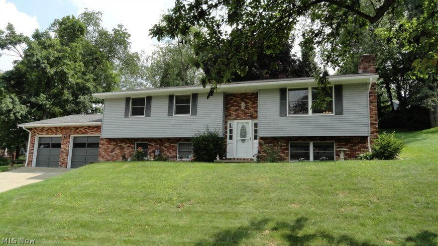 Nicely updated 3 bedroom, 2 bath home.  Tastefully decorated with a neutral decor throughout.  Brick woodburning fireplace in the living room.  Breakfast bar in the kitchen which opens to the dining room with sliding glass doors to the 12 X 24 back deck and patio.  His and hers closets in the master bedroom.  Stone woodburning fireplace in the family room in the lower level.  2 car attached garage.  Excellent south side location.  Spacious home in move in condition with updates throughout including floor coverings, new deck, patio, new roof (2014), light fixtures, exterior doors, garage doors and more!  Current owner's gas budget is $58 monthly, electric average is $130 monthly.