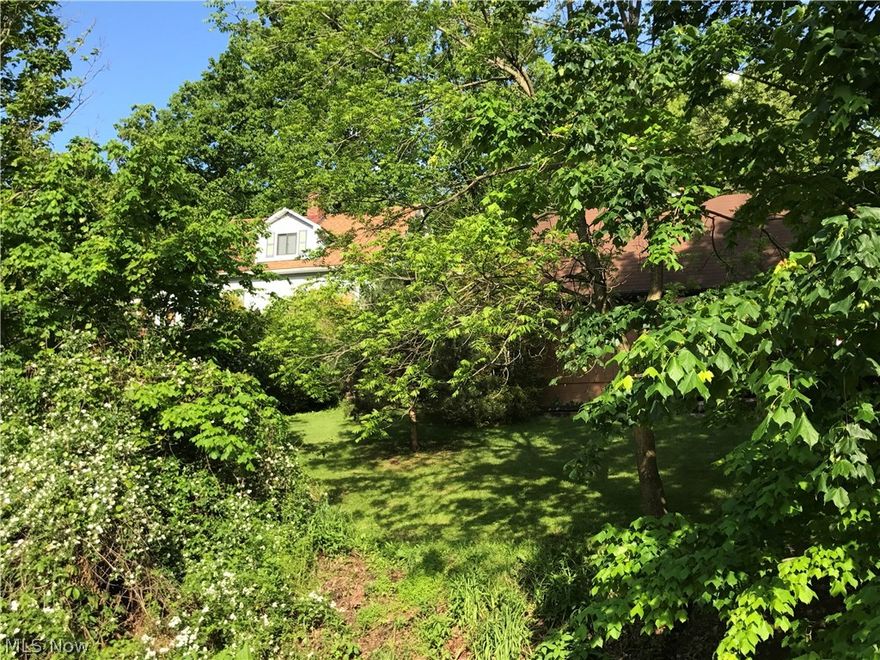 A Gardners Dream! Drive up your paved driveway and Enjoy your 1.66 acres with flowers and shrubs galore! Home features a wrap around deck, 2 porches, 3 bedrooms, 1 bath, two garages, (24 x24 and 15 x32.) new breaker box, ac, and roof. County Water, septic and two sources of heat, including an outside wood burner. Woven wire fence surrounds your property. Outdoor wood burner heats house and garage. 24 x24 Garage has running water and electric for a shop or an apartment.