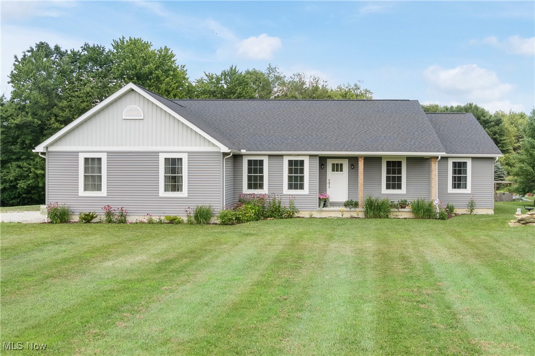 2018 Schumacher 4-Bedroom Ranch Home on 5 Acres! Located only minutes from Canton, Atwood and Mohawk Lakes, you'll find this Carroll County gem! Built on a full basement with poured concrete walls, the quality is quite evident. The open eat-in kitchen with quartz countertops, large island, walk-in pantry, French doors to the amazing rear porch, and cathedral ceiling into the great room with natural light. The master suite features large master bath with direct access into the laundry room and a wonderful walk-in closet. Three additional bedrooms with a 2nd bath are situated at the opposite end of the home, and an office located at the front door entrance. An attached 2-car garage leads to the mud room which has a built-in boot bench with coat rack. The vast basement level could be finished and has been rough plumbed for another bath. An awesome and functional home with lots of storage!
The lot itself is mainly level with excellent street access. From the back porch you can relax while looking over the backyard with garden area, and plenty of grass for horses or livestock. No zoning nor restrictions here. There's also some wooded area for enjoying wildlife, recreation, or hunting. Minerals do not convey. Septic system just passed the county required inspection. Call to schedule your viewing of this fine country property!