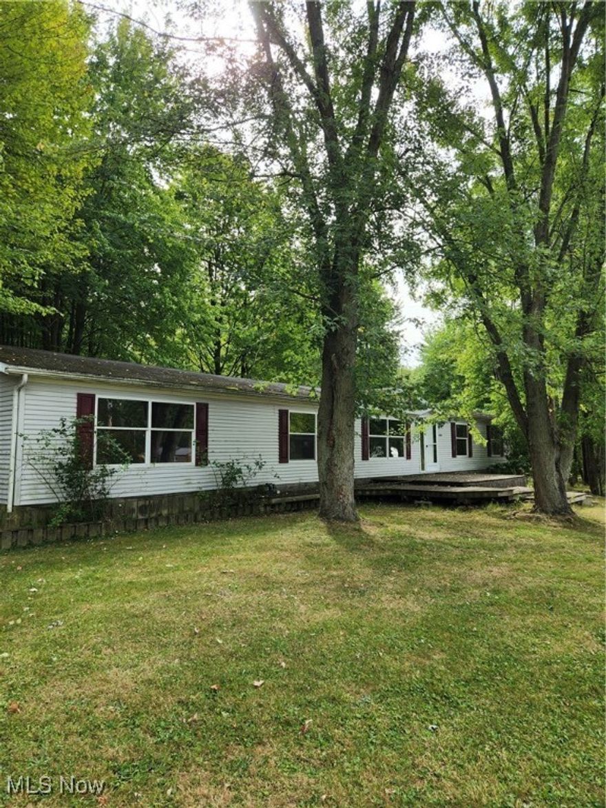 2000 built 2052 sq ft modular ranch on private 2.14 acres! 4 bed, 2 1/2 baths! Alliance city water & sewer! Master bed w/2 sinks and master bath w/walk in shower and walk in tub! Kitchen w/loads of cupboards and formal dining! Living room and family room w/woodburning fireplace! Laundry room w/1/2 bath and closet! New bathroom fixtures 2023! 22x24, 2 car wide garage however only single car door! Front and rear decks! Treed, peaceful setting!