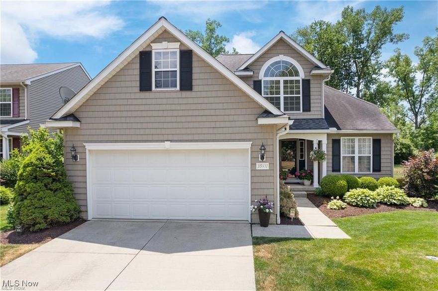 Prepare to be moved! Welcome to 39111 Princeton Circle, Avon. Bamboo hardwood floors set a warm, inviting tone as they carry through the living room, hallway, dining room, breakfast nook, and 4-seasons room. The living room’s vaulted ceilings draw the eye upward and flow naturally into the kitchen’s elevated ceiling line, giving the entire first floor a bright, connected feel. The kitchen has been thoughtfully updated with quartz countertops and matching backsplash, modern appliances, and crisp, contemporary lighting. Just off the kitchen, the sun-drenched 4-seasons room opens through a sliding glass door to the stamped-concrete patio—an easy extension of your living space for morning coffee or evening gatherings. The backyard offers privacy and is fully fenced. The first-floor primary suite offers privacy and comfort, complete with a beautifully remodeled ensuite bathroom. A convenient half bath and dedicated laundry room round out the main level. Upstairs, an open flex space greets you at the top of stairs. Two additional spacious bedrooms share a fully updated second bathroom, making the upper level perfect for family, guests, or a home office setup.