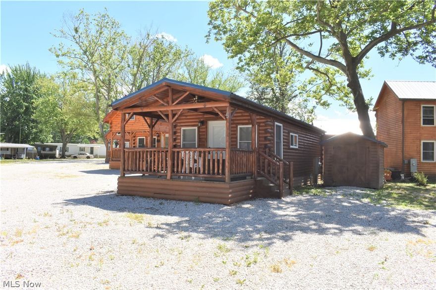 Opportunity awaits at this beautiful cabin located in the Cabins on the Lake Association in Saybrook Township, Ohio on the Banks of Lake Erie! Super cute and efficient home with the perks of being in a lakefront community with direct lake access just a short walk from your covered front porch! This is the perfect vacation getaway or second home! The recently formed association allows short-term rentals, so you can enjoy this one at your convenience and lease it when you're not there! The association fee includes water, sewer, trash, maintenance of common areas, and of course access to the lake! It's also snowplowed in the wintertime if you wanted to enjoy this cabin year-round. This beautiful home is being sold fully furnished and includes all the stainless steel appliances. Gas hookup is available if you ever wished to switch from  all electric that currently heats & cools the home. There's a storage shed for all of your lake toys and an area with a firepit to enjoy summer nights by t