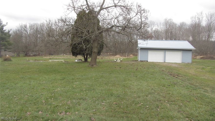 1.38 acres (200x300) lot in Cortland. Has large 2 car garage and well water. Excellent building lot.