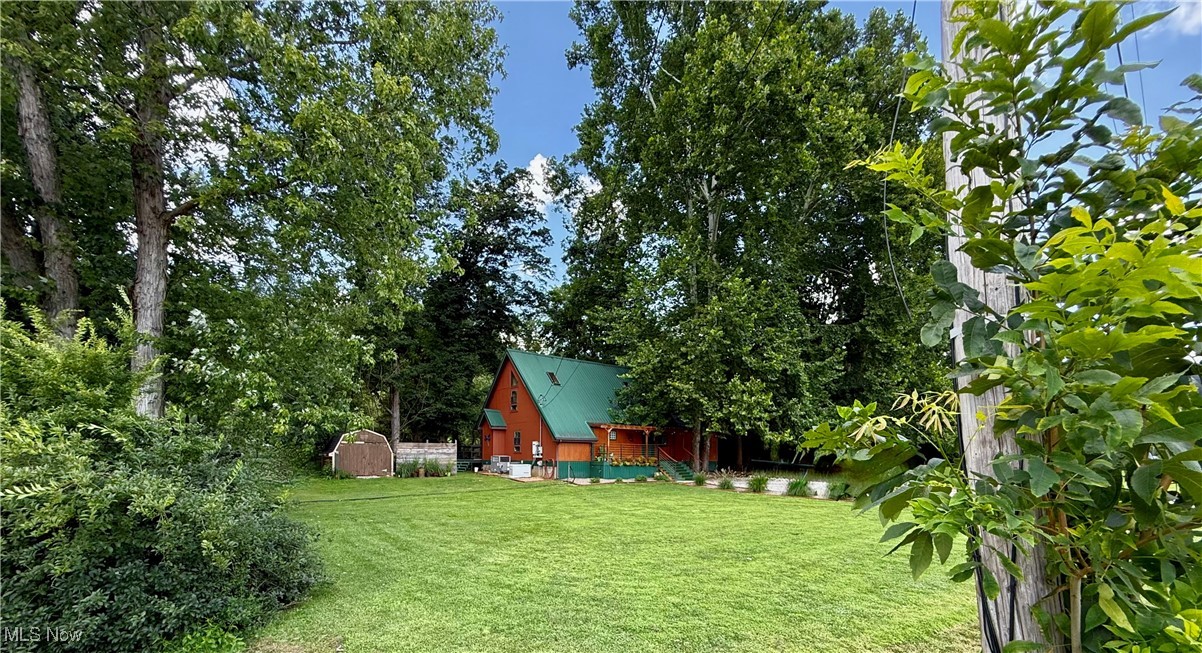 ASSUMABLE LOAN 2.9% INTEREST RATE!!! Welcome to your riverfront retreat on nearly 2 Acres. This 25 year-young home sits on a level lot and comes whimsically furnished, offering a one-of-a-kind lifestyle that feels more like a vacation than everyday living. Inside you will discover approximately 1800 sqft of quality craftsmanship throughout. Solid wood doors, gleaming hardwood floors, soaring vaulted ceilings, and oversized windows flow through each space. The eat-in, custom kitchen is a cook's dream featuring beautiful cabinetry, endless counter space and a massive island. Unique artistic touches are found throughout with hand-crafted switch plates to imaginative knobs. Living is made easy here with a main level master bedroom, bathroom, and laundry area. Freshly painted inside and out, the exterior also boasts new stain and refinished decking. Unwind in the jetted tub, soak in the hot tub under the stars, or enjoy peaceful mornings on the deck. Cast a line right from your riverbank or simply relax and take in the serenity. Located a couple of miles from a golf course and a well-equipped shooting range, you're promised a blend of rural living with the convenience of engaging leisure activities just minutes away. This home is more than just a place to live...it’s a whimsical retreat you’ll never want to leave.