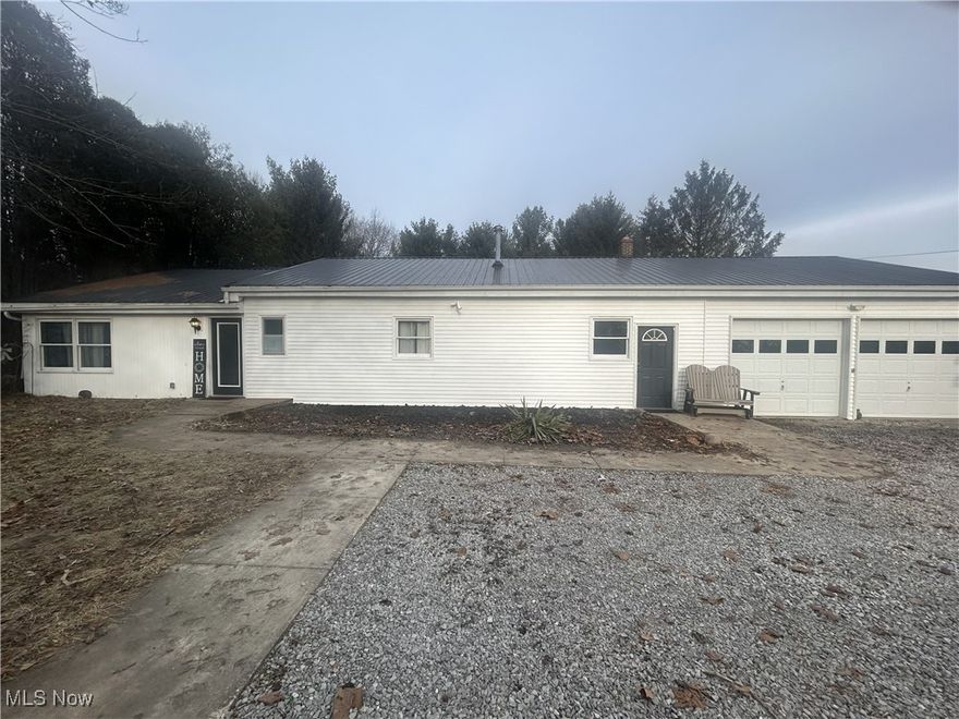 Beautiful property offering one-level living and a long list of updates throughout. The home features recently remodeled kitchen with stone backsplash, appliances, updated baths, a 2024 furnace and thermostat, and the roof was replaced in 2019. Enjoy the spacious layout & large rooms, a jetted tub, public water and sewer, and a fully fenced yard and pasture. The outdoor amenities include a pond, fruit trees, berry bushes, and a play set. Ideal for a hobby farm, the property offers an oversized 2-car attached garage along with several outbuildings, including a 3-stall barn with chicken coop, a 42 x 24 detached 3-car garage with electric and water, a small 1BR/1BA apartment with a 1-car garage that needs rehab, a 24 x 14 garage with electric, and a 32 x 22 utility building with a wood-burner in the workroom. Additional frontage on State Route 250 provides excellent access and visibility. Back of property is in Clearcreek Twp and not in village. Baily Lakes has 2 new parks coming soon.