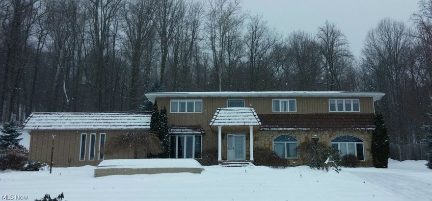 Live & Play in your own private resort!  Lap pool in Great Room w/ Private Sauna! Billiard Room in loft area for entertaining.  Lake Mohawk is one of Ohio's premiere private-gated communities w/ a Golf Course, 2 Beaches, Waterskiing, Ski Club Membership, year-round fishing & boating.  
This home provides convenience to the front gate as well as a beautiful patio to entertain your guests with a custom-built waterfall to provide a serene background.  The hillside behind the house is home to country wildlife.  Many deer can be seen running through the beautiful wooded area.  The flowers are a lush background to this resort setting in the Spring & Summer months that will inspire your family. 
The spiral staircase leads from the Great Room where you can Swim, eat, or watch a movie up to the billiard room for some friendly competition. There is a refrigerator in the billiard room for the convenience of your guests.
New Hot Water Heater January 2015/New LED recessed lights in vaulted ceili