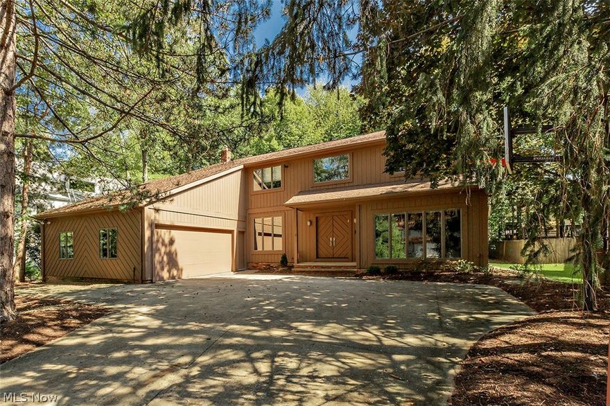 An incredible opportunity awaits in the friendly, unique Orangewood Community.  This colonial style, with contemporary flair, was originally quality built by builder for personal use, current owners have taken immaculate care. Delight as you enter dramatic 2-story foyer w/open staircase & catwalk. One step down or one step up to light-filled, formal living room or dining room, both w/floor to ceiling windows.  Great room/family room has vaulted wood ceiling, wood-burning fireplace, built-ins and sliders to deck overlooking private, wooded backyard. Adjacent eat-in kitchen also has sliders to over-sized deck & has great flow, highlighted with center island w/vegetable sink, stove top & lots of storage. Large laundry/mud room located between garage & kitchen has 2 double closets, newer washer & dryer & ½ bath. Library/study (possible 5th or guest bedroom) and powder room complete the main floor. Second floor has master suite wing w/private bath & abundance of closets. North wing has larg