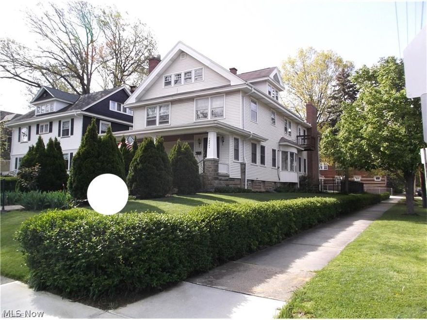 WANT LOCATION?  Situated on grand Lake Avenue across from Lakewood Park and Lake Erie breezes!  NEED SPACE?  This stately, expanded Lakewood colonial has it all:  Over 4100 SF of living space ... 5-6 ample sized bedrooms and 5 full bathrooms; a large eat in kitchen and great room off the kitchen with stone fireplace; a formal dining rm with bay windows; and, a huge master suite with adjoining full bath and spacious reading room with another fireplace.  The finished third floor offers a 6th bedroom, 5th full bath and a bonus room while the finished lower level adds a game room, full bath and fireplace!  WANT QUALITY?  The home features 9' ceilings and all natural woodwork including:  moldings, inlaid wood floors, solid wood doors and built ins.  There are stained glass windows and 4 fireplaces (3 with gas starters)!  The electric and plumbing has been updated, a steal beam support system added and a newer concrete drive.  Exterior features include a spacious covered front porch, vinyl/b