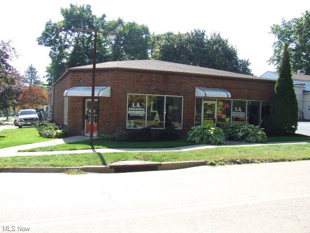 Great, stand alone building with possible 3 units, 2 units or 1 large unit. Currently 2 units open to each other with sliding barn door to attached, heated garage for additional storage or useage. Current use has been a seamstress/alterations business for over 20 years, sometimes two separate businesses, sometimes combined. One side has two dressing rooms which could be removed and a kitchenette area with sink and cupboards/counter. Other side has faux wall in back for privacy/separation, that could be removed and the only half bathroom. Each side has it's own furnace, whole house fans, and electric boxes. Right side/524 has 3-phase electric, no a/c, furnace older but runs great and has been serviced regularly, half bath. Left side/526 has a/c, furnace 10 years, 2 dressing rooms, kitchenette area, and door to attached garage. Garage has Reznor gas hanging heater, whole house fan, utility sink, the building's hot water tank which is less than 1 year, and security magnetic mandoor/Vector Security alarm. Roof is one month old. Most of the contents also for sale, could be different from pictures as things are sold. Listing agent must be present for all showings. Property sells "As Is".