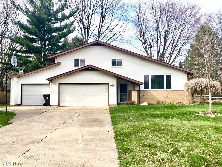 Come see this  split level with loads of  potential and sits on almost a half acre  in the heart of Solon. Dining room/ living room combo is located off of the eat in kitchen that overlooks the family room.  Sliding glass doors located in family room  lead you out to the spacious, private backyard.  3 nice size bedrooms and a full bath located on the 3rd floor.  Spacious basement with lots of storage.  Handyman workroom behind the third garage.   Bring your creative ideas, and decorator and transform this home into a gem!