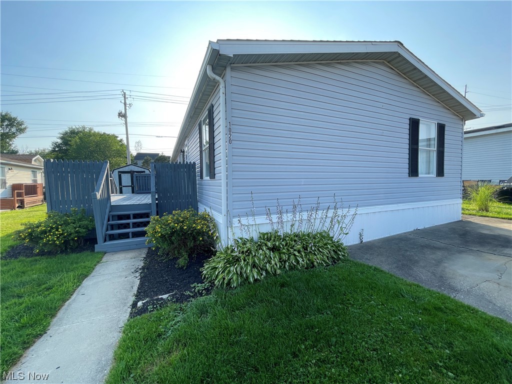 What a fantastic find as a starter or downsize option! Affordable mobile home, well maintained and spacious, located in the newest portion of Camelot Village. Roof installed in 2020. Vaulted ceilings make this double wide seem even bigger. Freshly painted kitchen has plenty of sunlight, storage and counter space, and appliances stay. Washer and dryer stay. Possible 4th bedroom in current family room. Master bedroom has a large closet that was originally intended to be a master bath, and can be converted. All ac window units stay. Two sheds offer a great amount of outdoor storage. A place you will be happy to call your own!