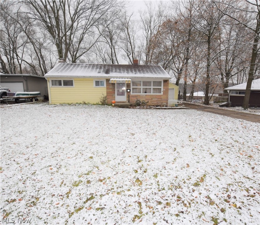Welcome to 42 Highland Drive! This lovely 3-bedroom, 1-bathroom ranch located on a quiet dead end street in Tallmadge has numerous updates throughout. Spacious living room with large windows overlooking the front yard. Kitchen has beautiful new waterproof COREtec flooring (2019), new counter top and stainless steel sink (2019), and newer windows (2017). Bathroom was remodeled with new COREtec waterproof flooring, pedestal sink, toilet, tub, and surround (2019). Bathroom closet has shelves offering convenient storage space. Three nicely sized bedrooms painted neutral colors. Partially finished basement has large rec room with a brick fireplace, a large storage closet with shelves, a bonus room, and a storage area with washer and dryer. All interior doors are brand new. Carpet replaced in 2016. Backyard is fully fenced in with a wooden patio – perfect spot for relaxing outside. Detached one-car garage. Conveniently located 0.5 mile from the Tallmadge Circle. No worries as this one comes
